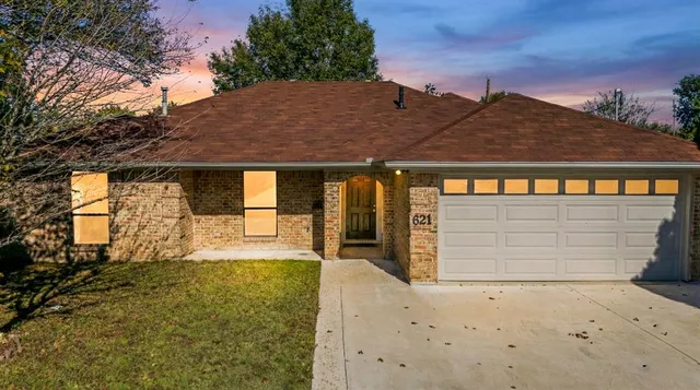 front view of a house with a large window