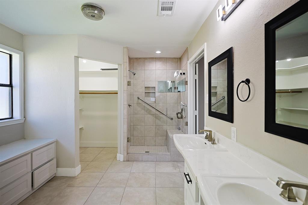 621 Main Street Roanoke, TX 76262 - Photo 15 of 30 a bathroom with a sink and mirror