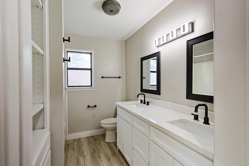 621 Main Street Roanoke, TX 76262 - Photo 19 of 30 a bathroom with 2 sink and a mirror