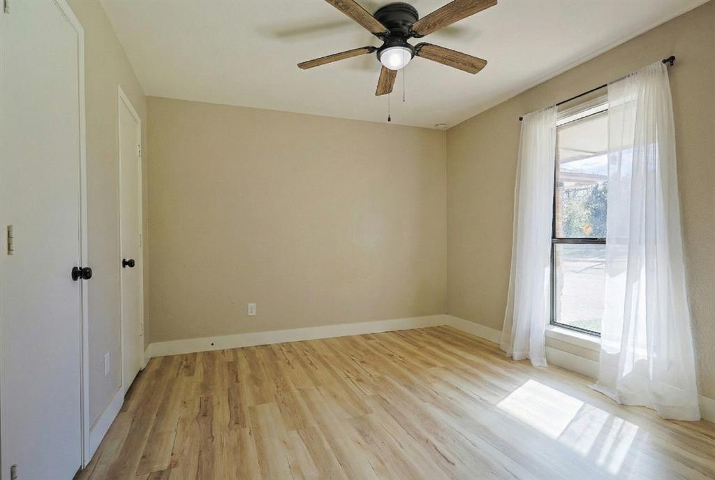 621 Main Street Roanoke, TX 76262 - Photo 21 of 30 wooden floor in an empty room with a window