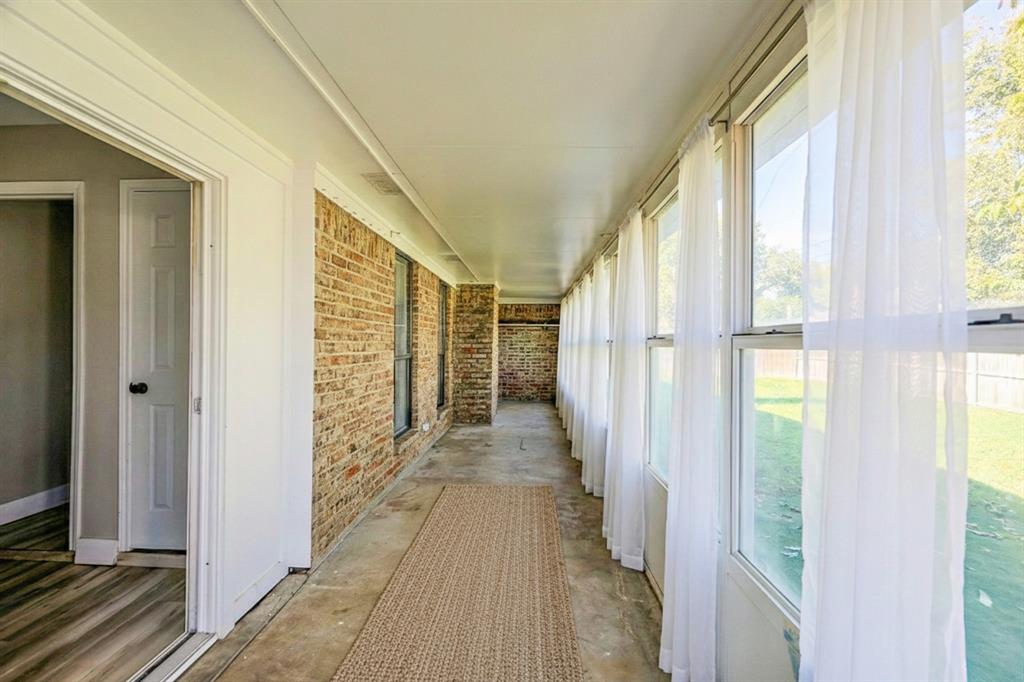 621 Main Street Roanoke, TX 76262 - Photo 24 of 30 a view of a hallway with wooden floor and windows