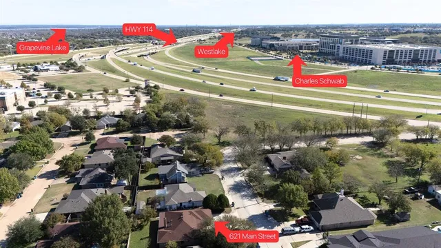 an aerial view of residential houses with outdoor space