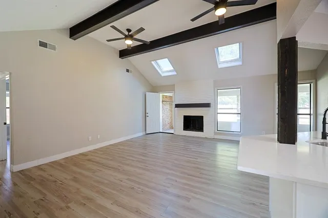a view of living room with furniture and wooden floor