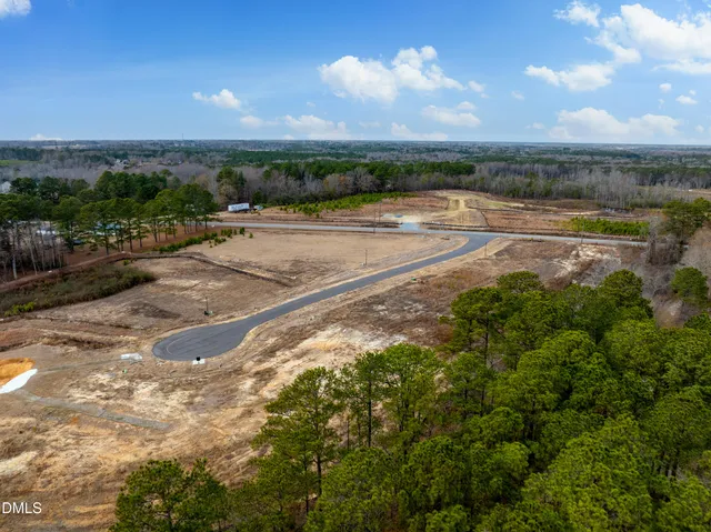 a view of a lake with beach and city view