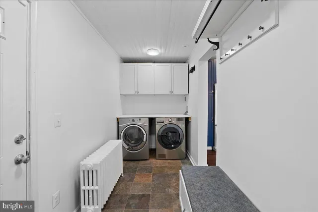 a view of a hallway with washer and dryer