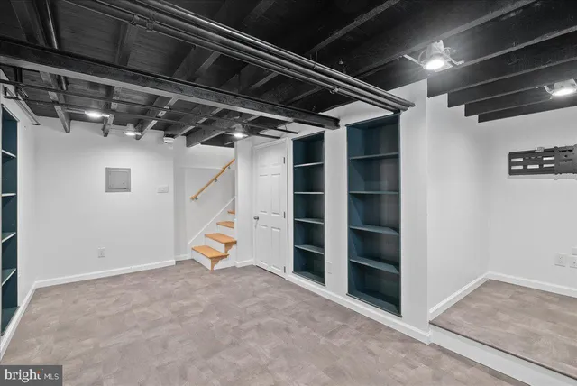 a view of an empty room with storage