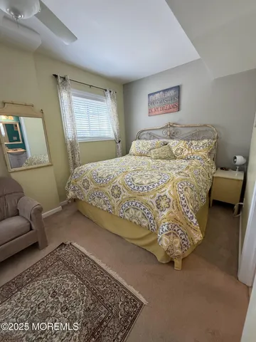 a bedroom with a bed and glass window
