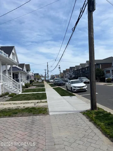 a view of swimming pool with seating area