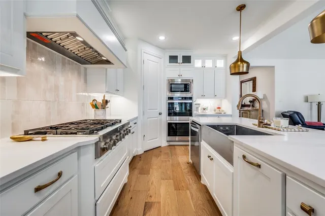 a kitchen with a stove and a sink