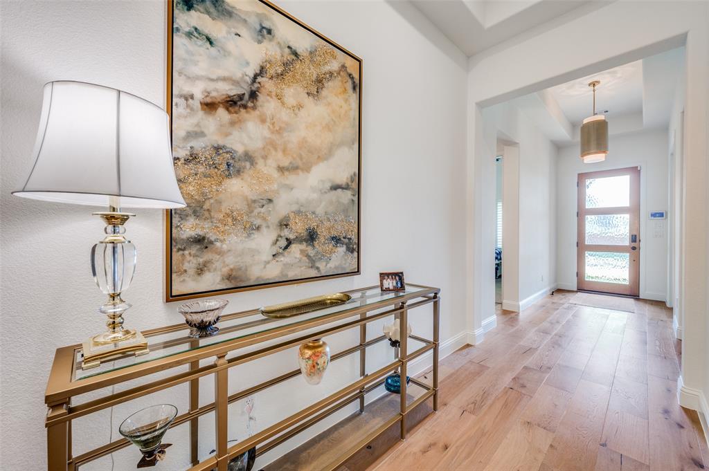 2390 Red Cedar Trail Prosper, TX 75078 - Photo 2 of 40 a view of a room with wooden floor and cabinet