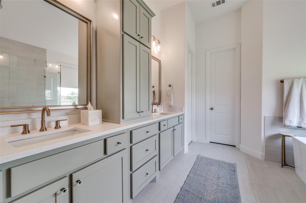 2390 Red Cedar Trail Prosper, TX 75078 - Photo 26 of 40 a spacious bathroom with a double vanity sink and a mirror