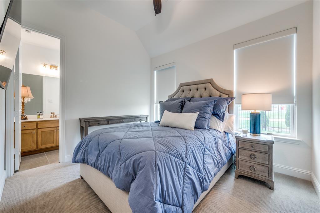 2390 Red Cedar Trail Prosper, TX 75078 - Photo 28 of 40 a bedroom with a bed and a view of en suite bathroom