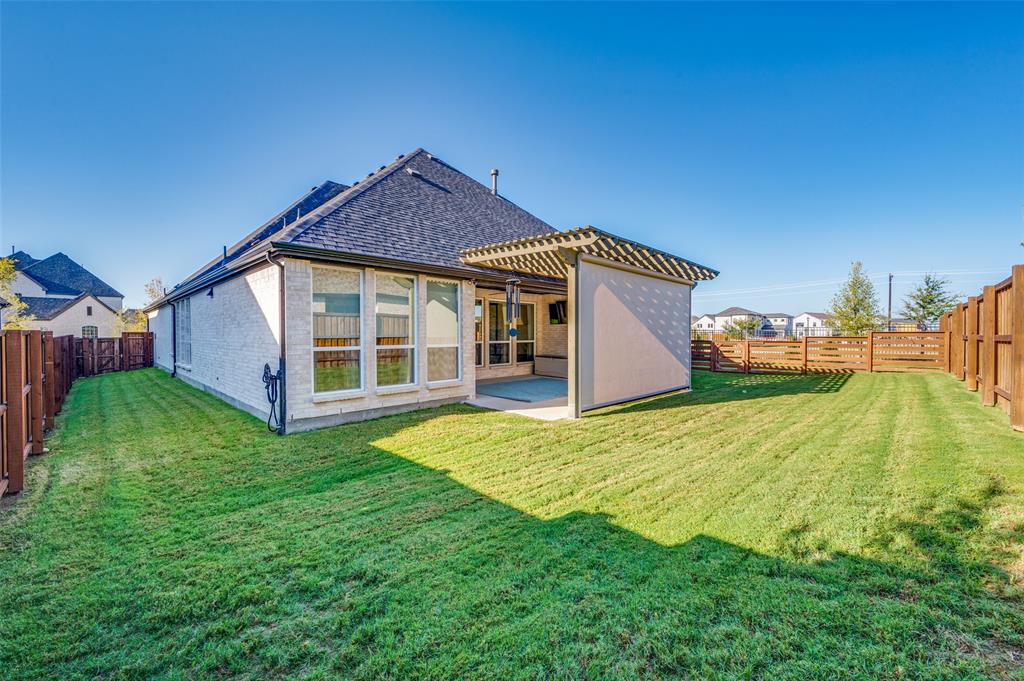 2390 Red Cedar Trail Prosper, TX 75078 - Photo 34 of 40 a view of an house with backyard space and balcony