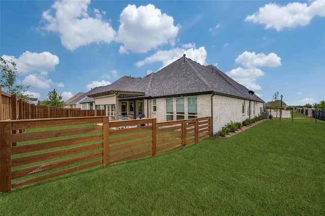 a front view of house with yard and entertaining space