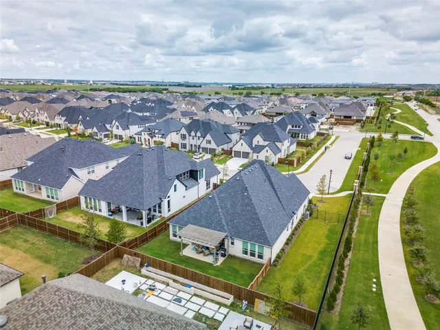 an aerial view of a house with a swimming pool