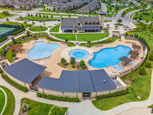 an aerial view of a house with garden space and street view