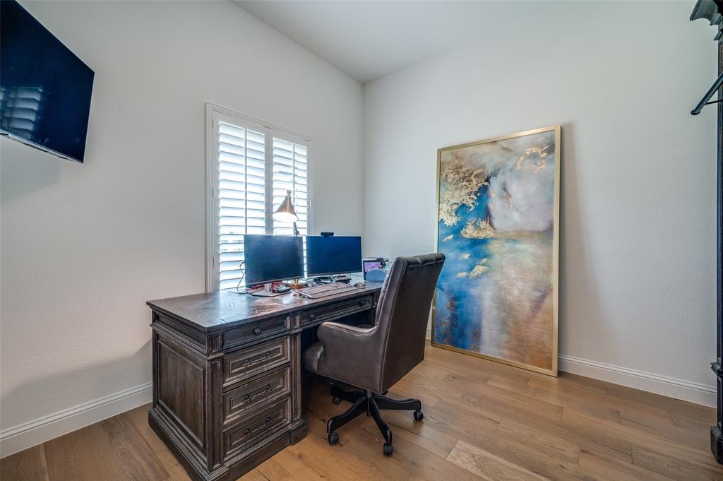 2390 Red Cedar Trail Prosper, TX 75078 - Photo 4 of 40 a view of a workspace with furniture and a window