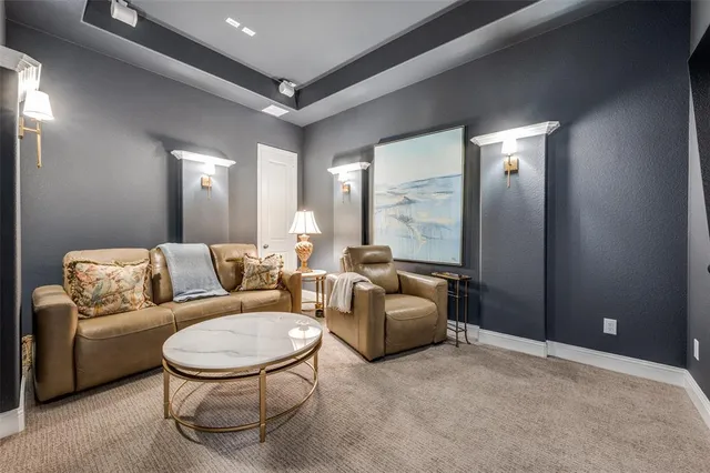 a living room with furniture and a mirror