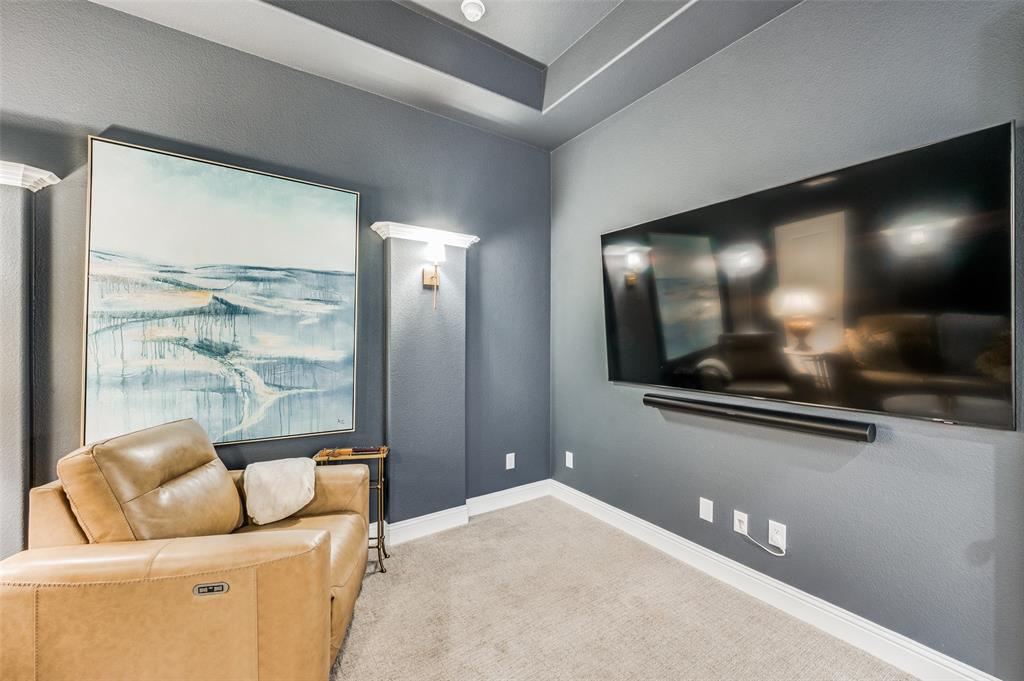 2390 Red Cedar Trail Prosper, TX 75078 - Photo 8 of 40 a living room with furniture and a flat screen tv