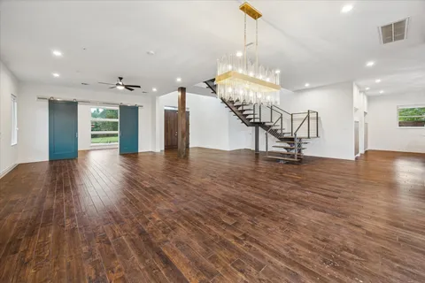 a view of an entryway with wooden floors