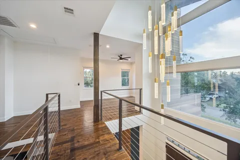 a view of a living room and a balcony