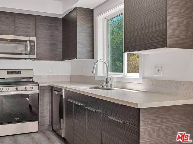 a kitchen with a sink and a stove