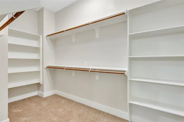 a view of an empty walk in closet
