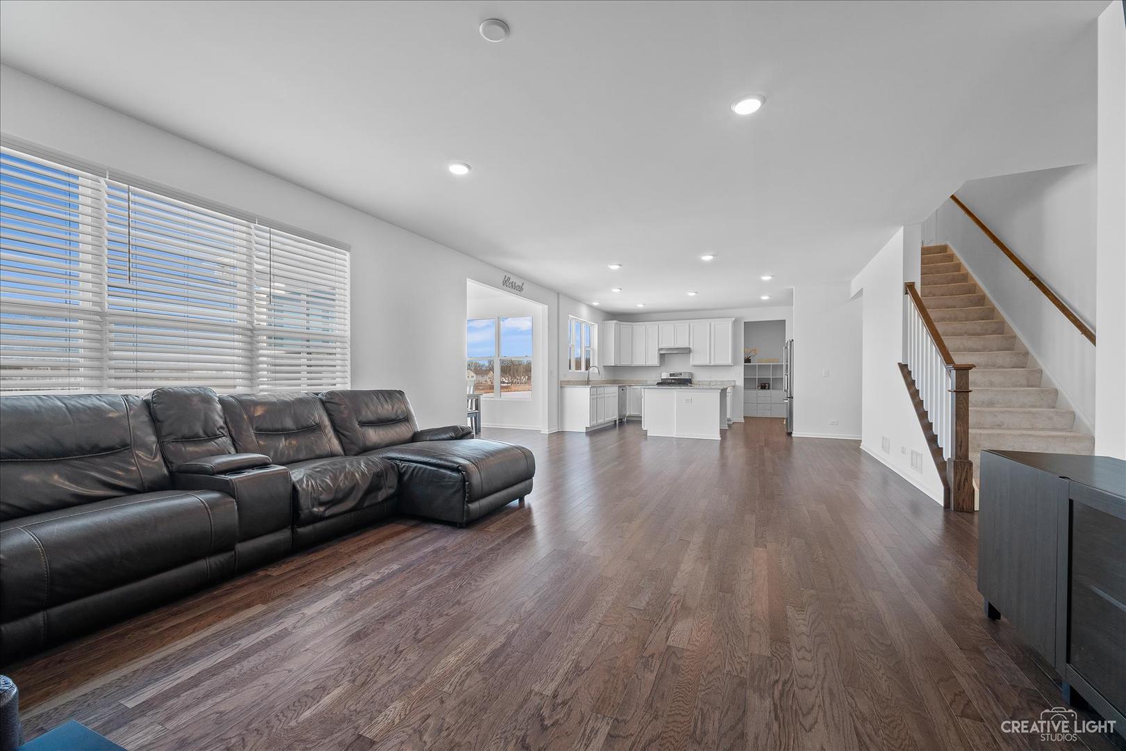 4341 Rudyard Kipling Road Elgin, IL 60124 - Photo 6 of 30 a living room with furniture and a wooden floor