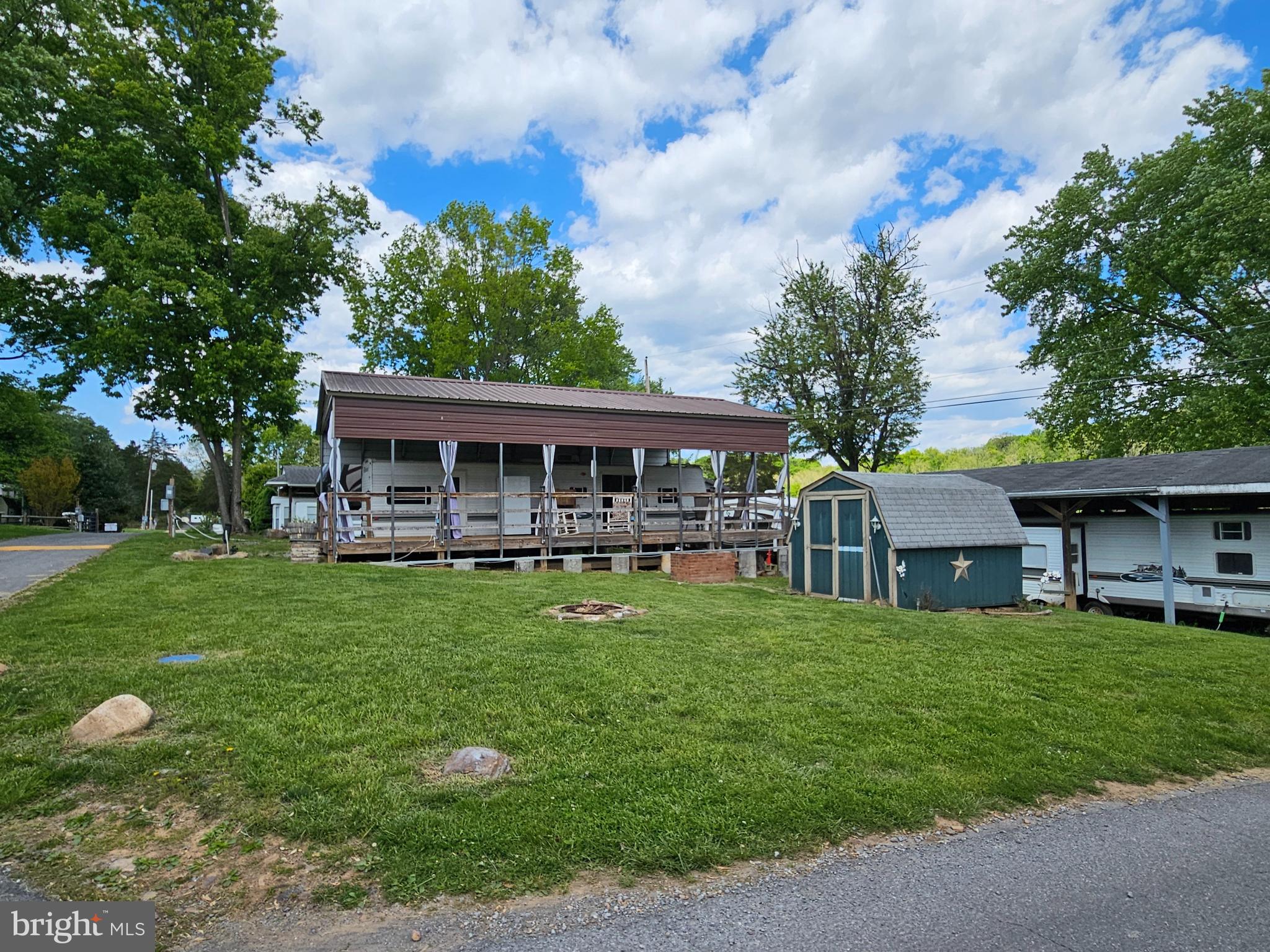 21 Campfire Boulevard Falling Waters, WV 25419 - Photo 1 of 30 a view of a house with a yard and sitting area
