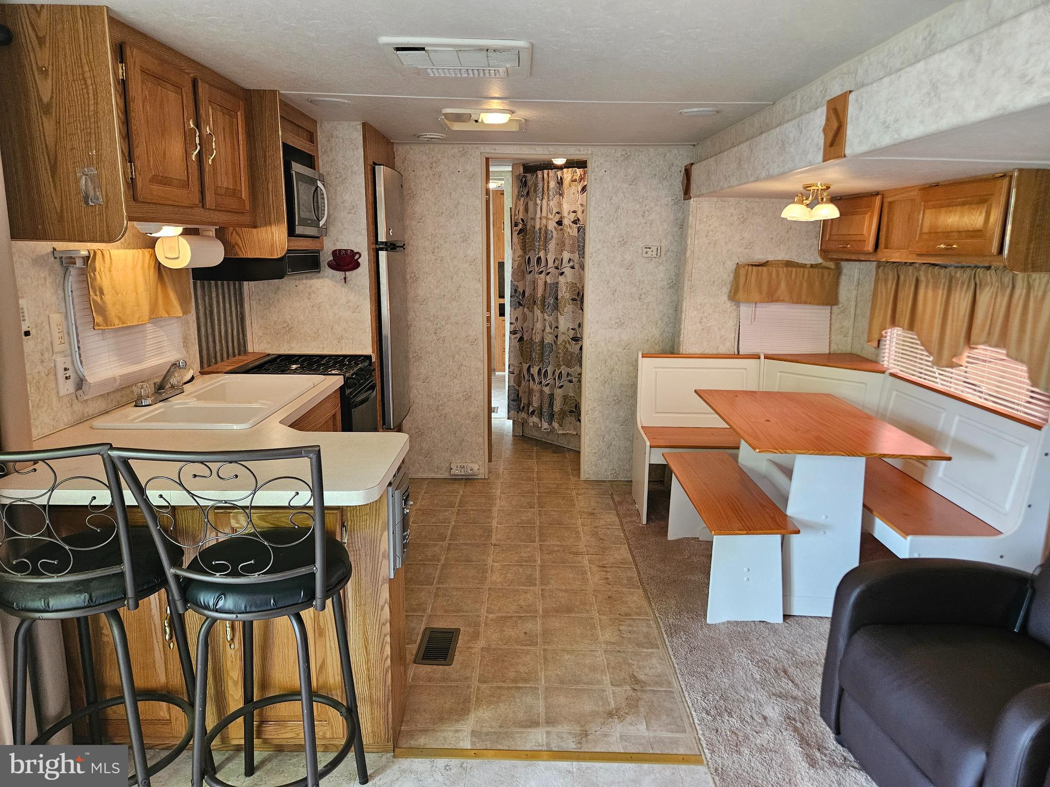 21 Campfire Boulevard Falling Waters, WV 25419 - Photo 12 of 30 a view of kitchen with furniture and chandelier