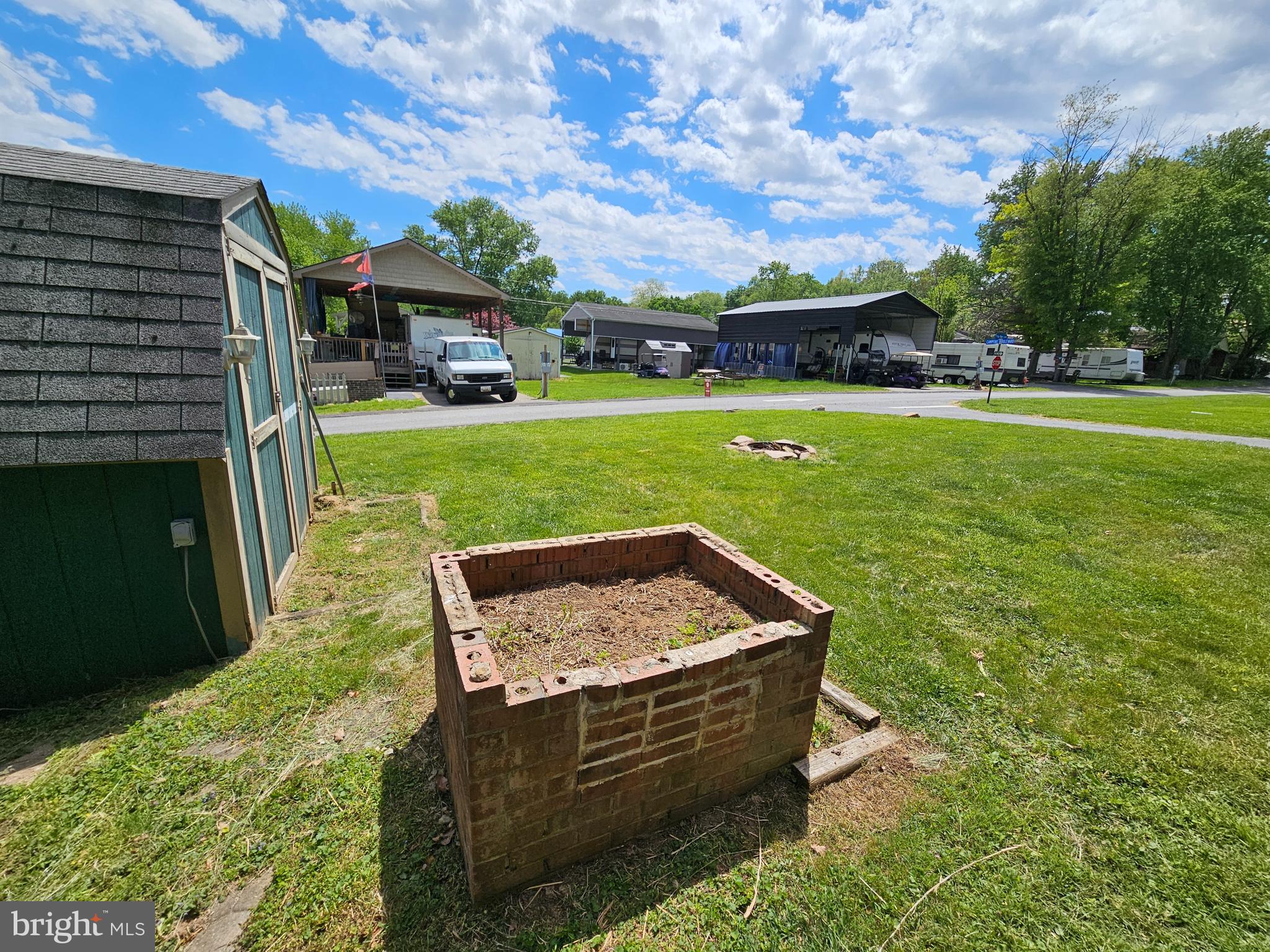 21 Campfire Boulevard Falling Waters, WV 25419 - Photo 20 of 30 a view of a garden with an outdoor seating