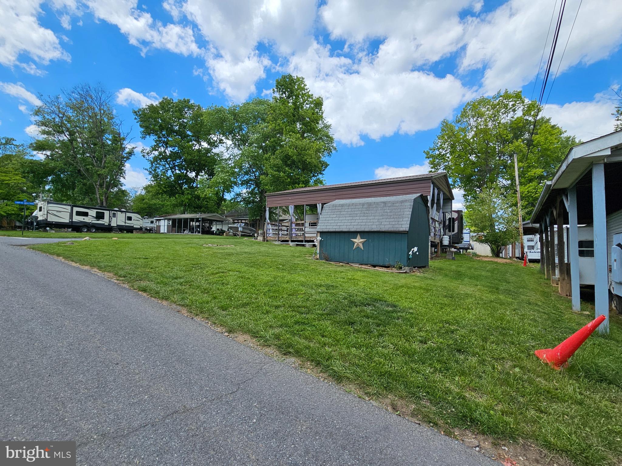 21 Campfire Boulevard Falling Waters, WV 25419 - Photo 2 of 30 a view of a house with a yard and sitting area