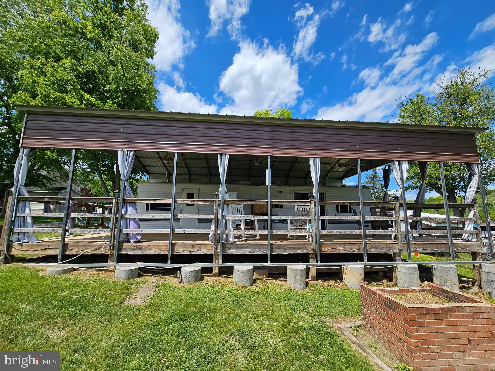 21 Campfire Boulevard Falling Waters, WV 25419 - Photo 4 of 30 a view of a house with backyard porch and sitting area