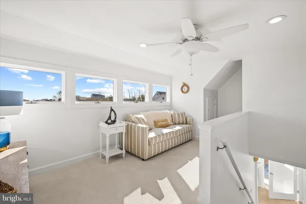 a spacious bedroom with a bed and a chandelier