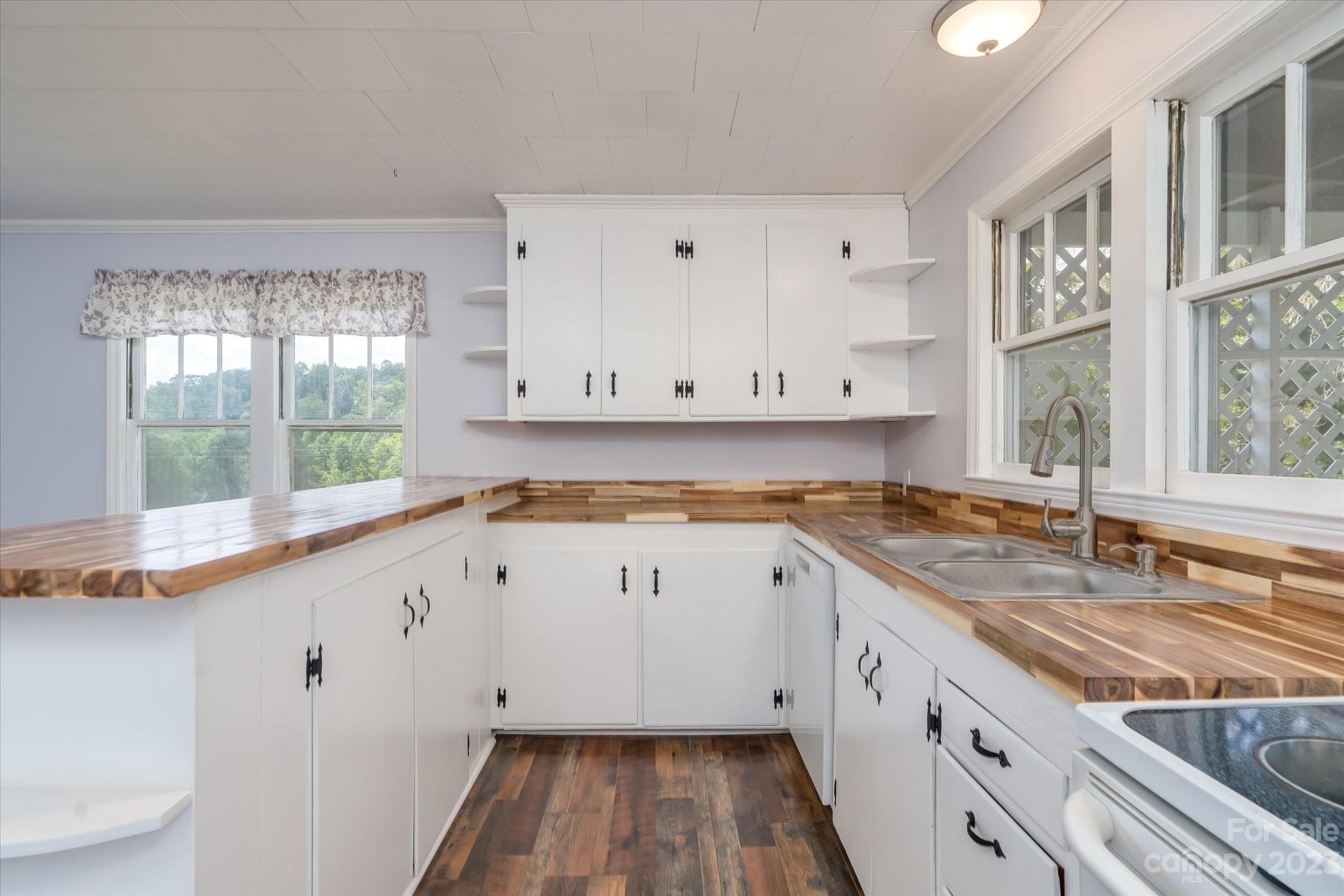 2540 Maple Creek Road Rutherfordton, NC 28139 - Photo 12 of 48 a kitchen with granite countertop white cabinets and a sink