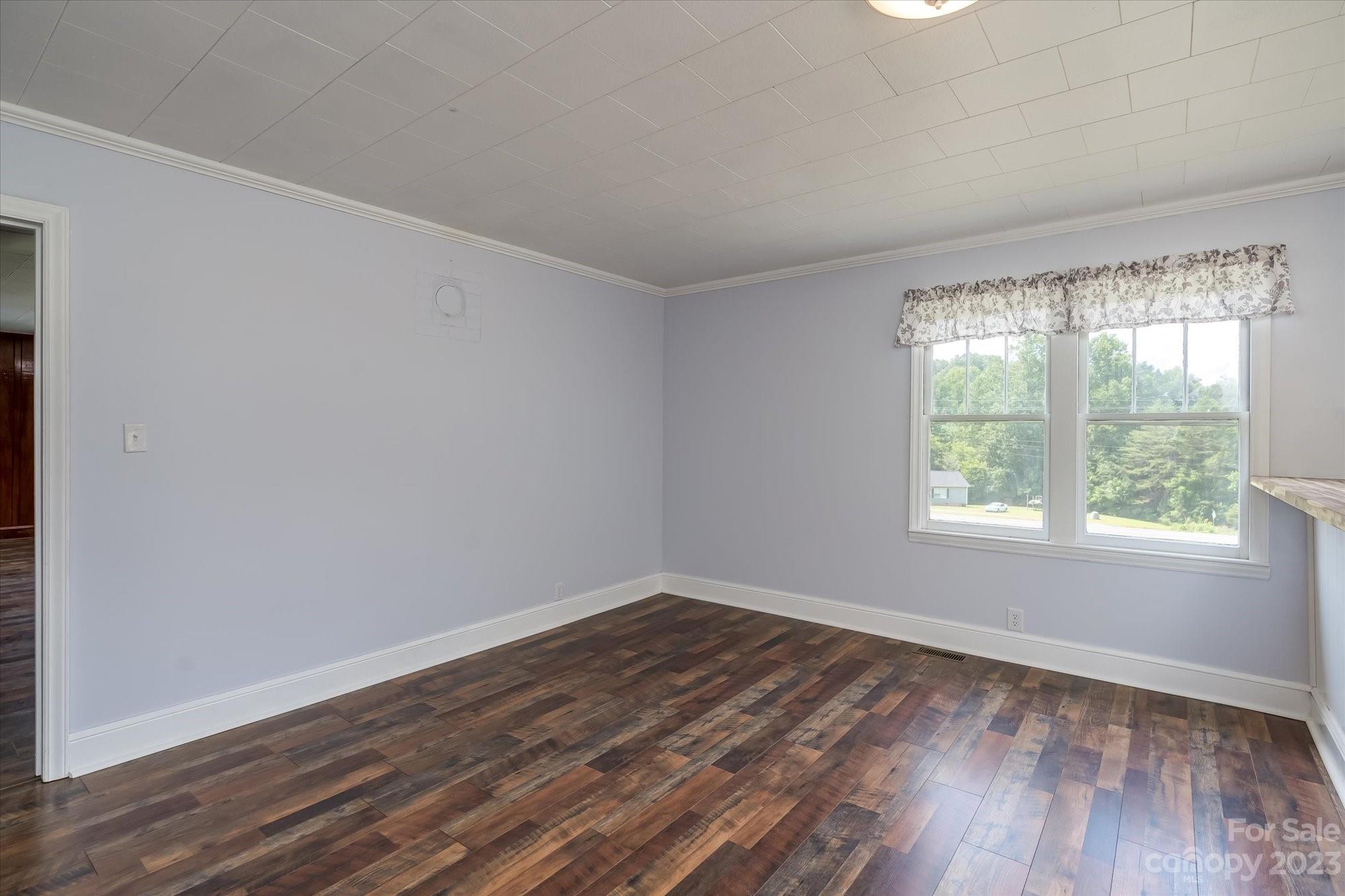 2540 Maple Creek Road Rutherfordton, NC 28139 - Photo 17 of 48 an empty room with wooden floor and windows