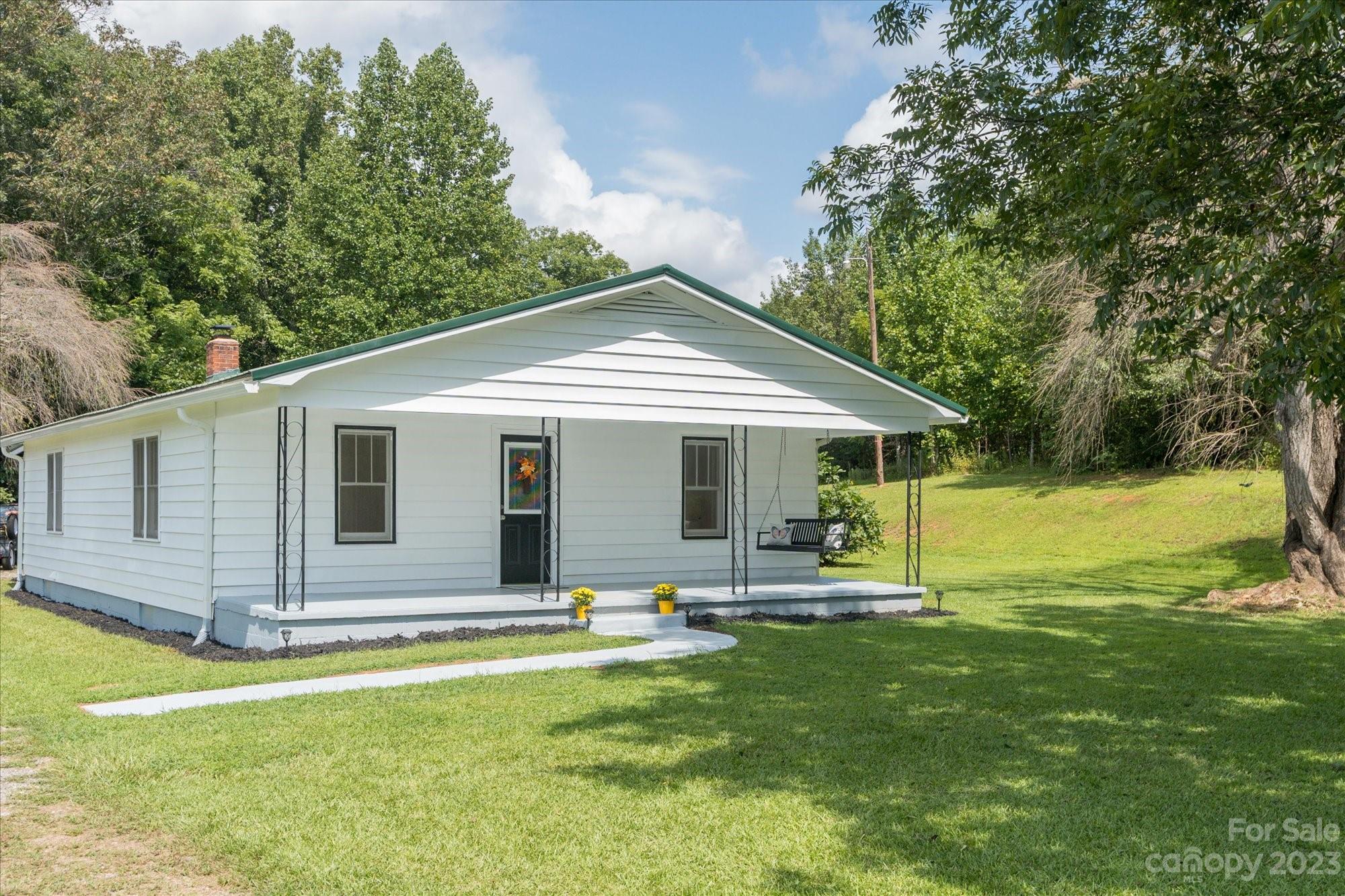 2540 Maple Creek Road Rutherfordton, NC 28139 - Photo 18 of 48 a front view of house with garden