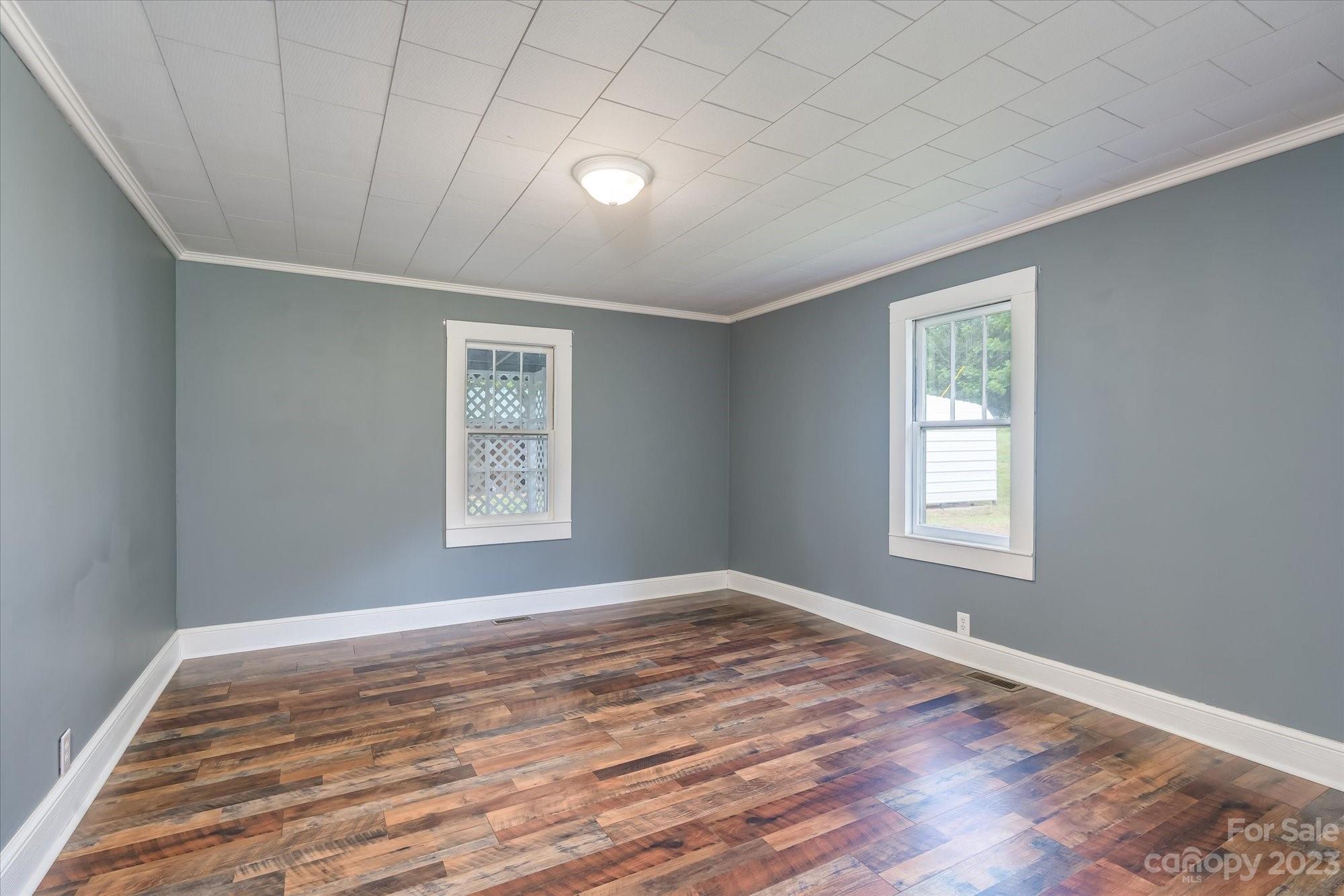 2540 Maple Creek Road Rutherfordton, NC 28139 - Photo 24 of 48 a view of an empty room with wooden floor and a window