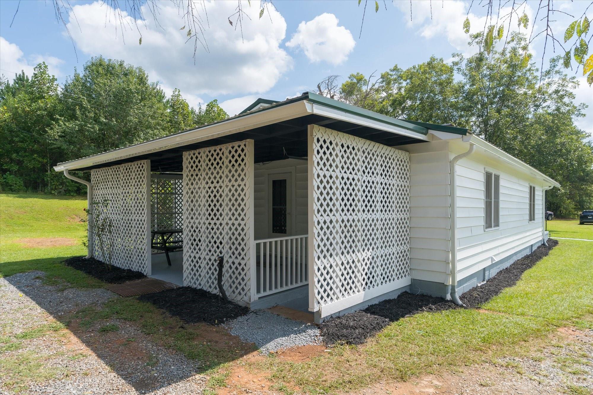 2540 Maple Creek Road Rutherfordton, NC 28139 - Photo 28 of 48 a front view of a house with garden
