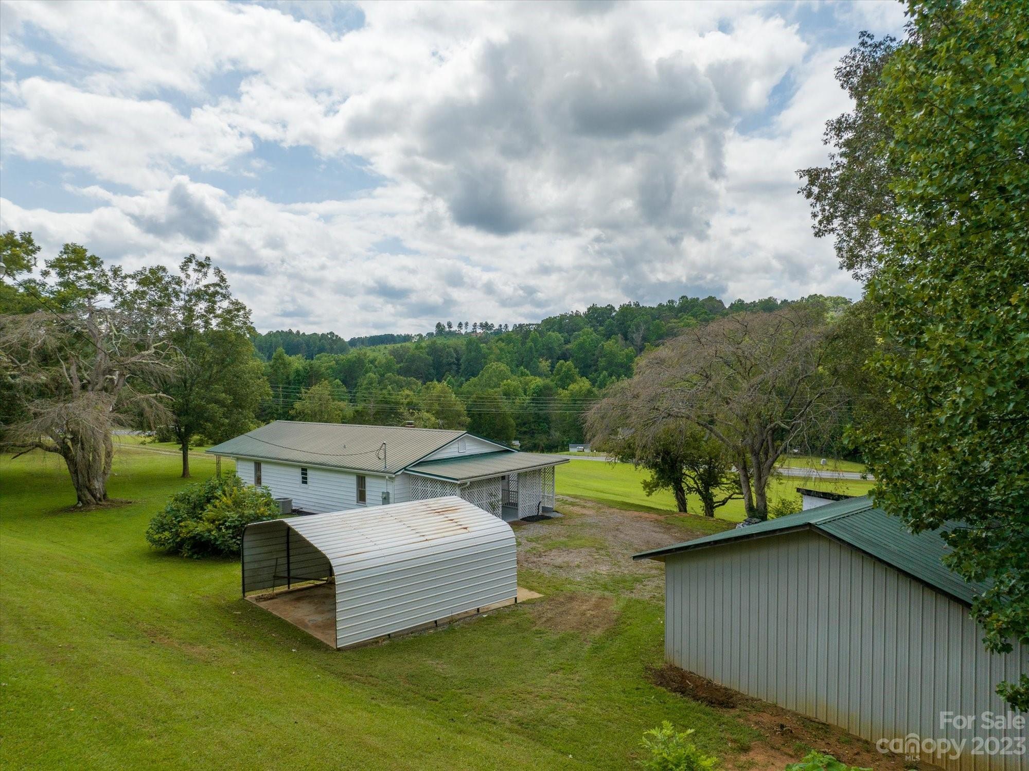 2540 Maple Creek Road Rutherfordton, NC 28139 - Photo 39 of 48 a view of a garden with lawn chairs