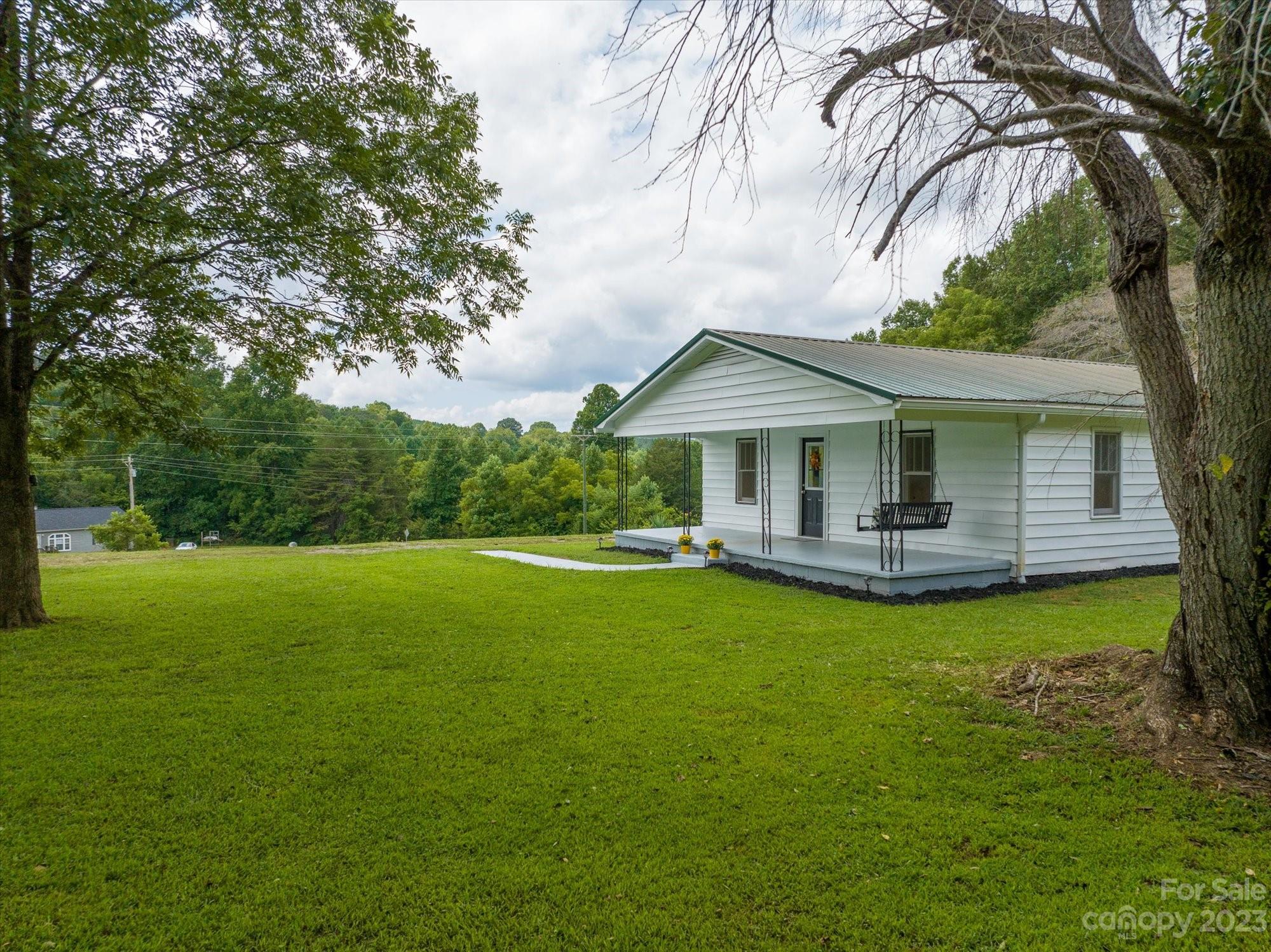 2540 Maple Creek Road Rutherfordton, NC 28139 - Photo 4 of 48 a front view of a house with yard and green space