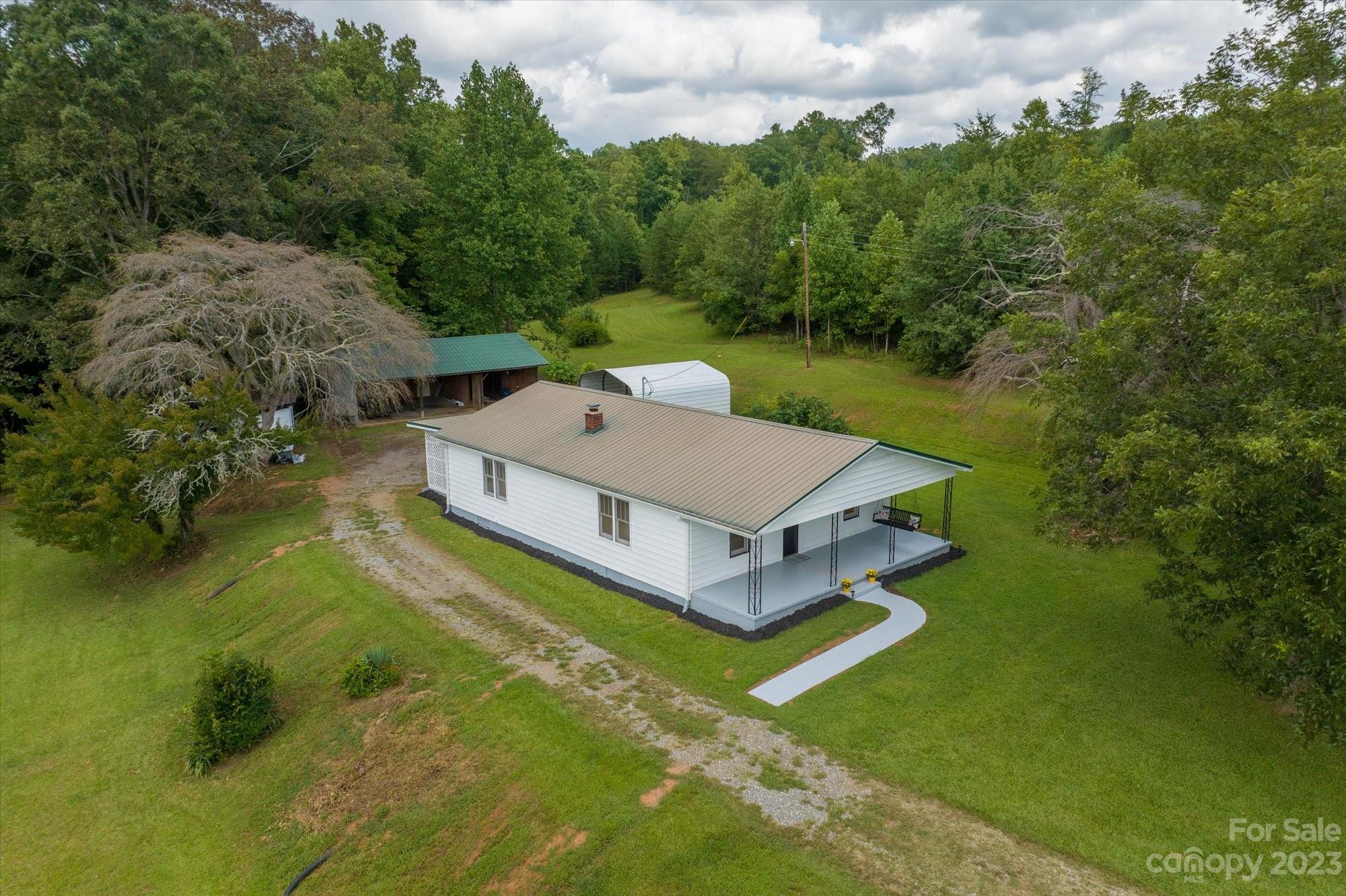 2540 Maple Creek Road Rutherfordton, NC 28139 - Photo 43 of 48 an aerial view of a house with swimming pool and garden