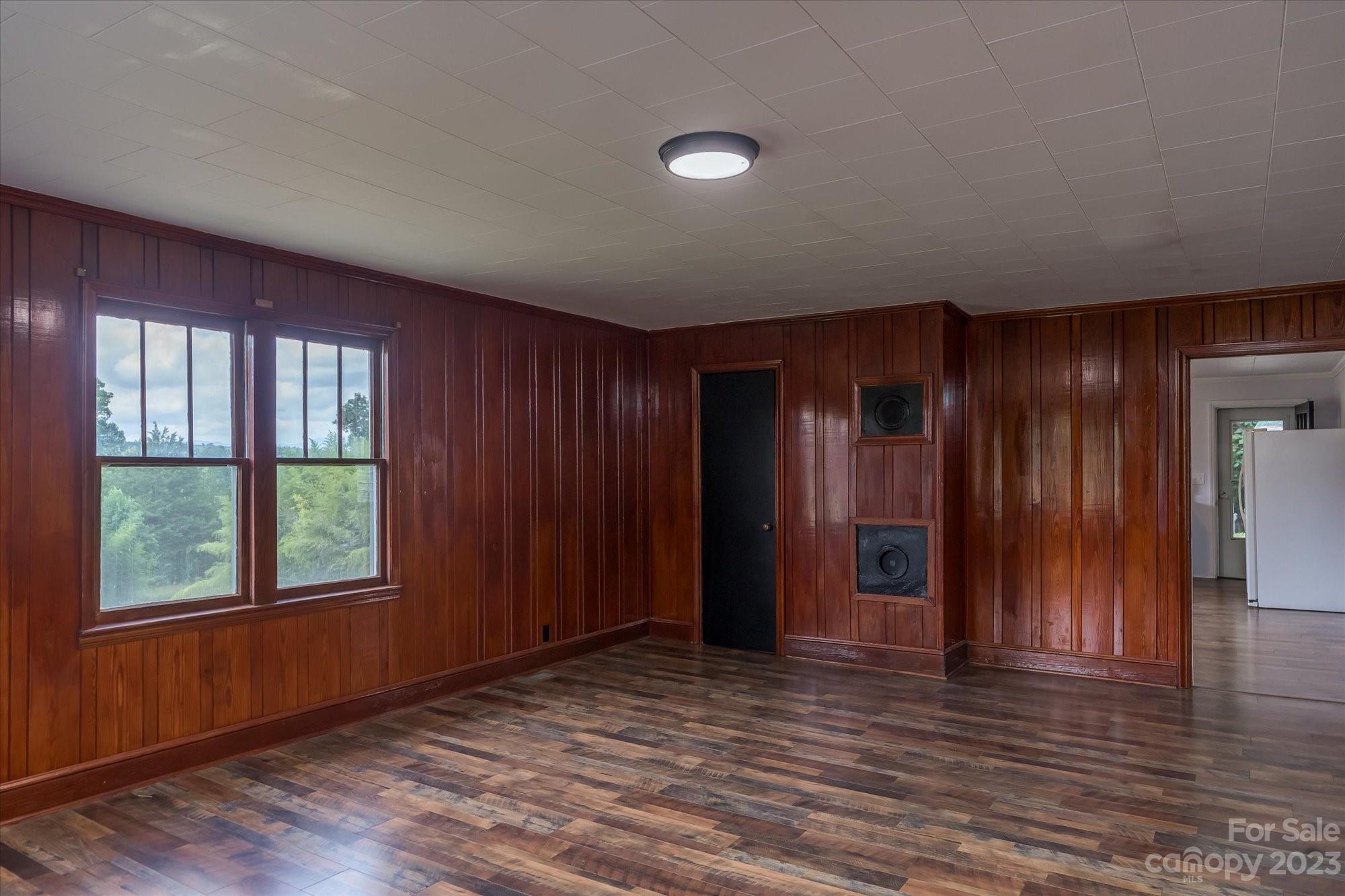 2540 Maple Creek Road Rutherfordton, NC 28139 - Photo 9 of 48 an empty room with wooden floor and windows