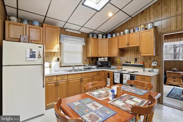 a kitchen with a sink appliances and a counter top space