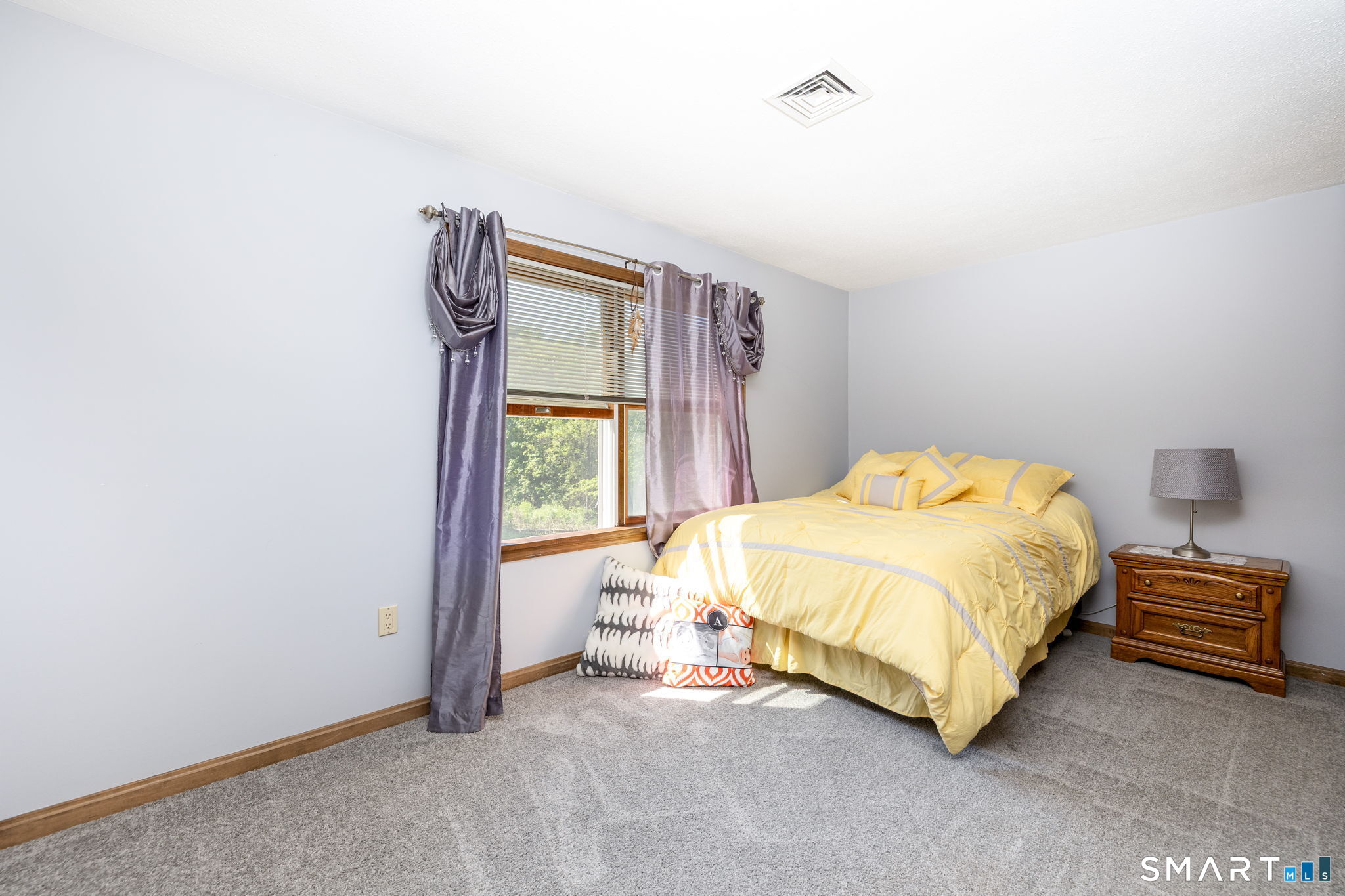 39 Chapman Road Marlborough, CT 06447 - Photo 16 of 40 a spacious bedroom with a bed and a window