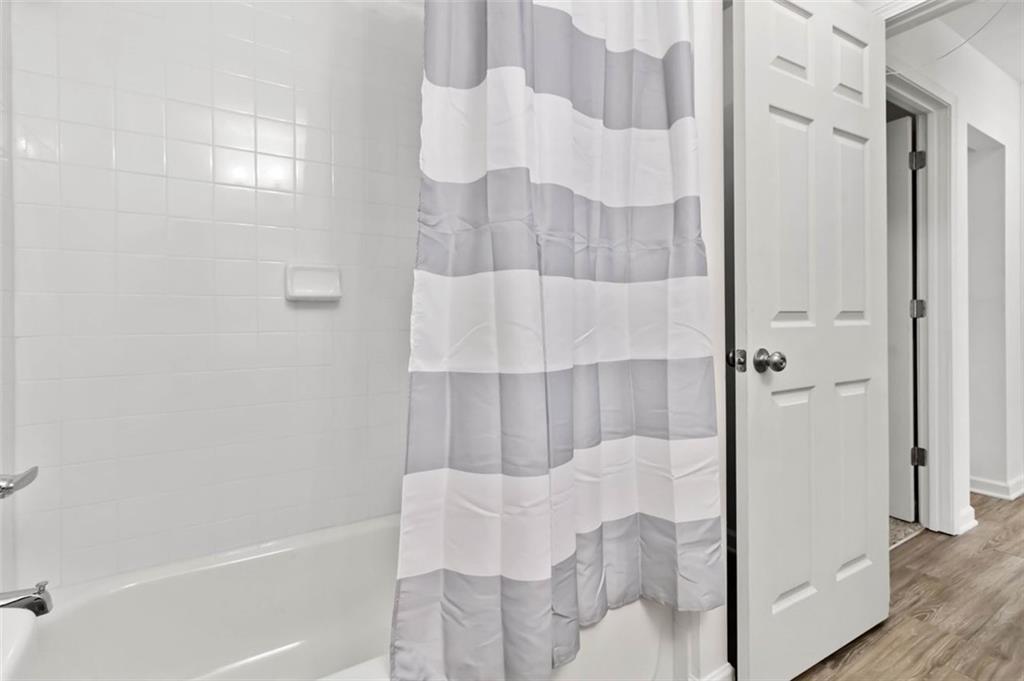 2340 Beaver Ruin Road, Unit 16 Norcross, GA 30071 - Photo 16 of 28 a bathroom with a bathtub and shower
