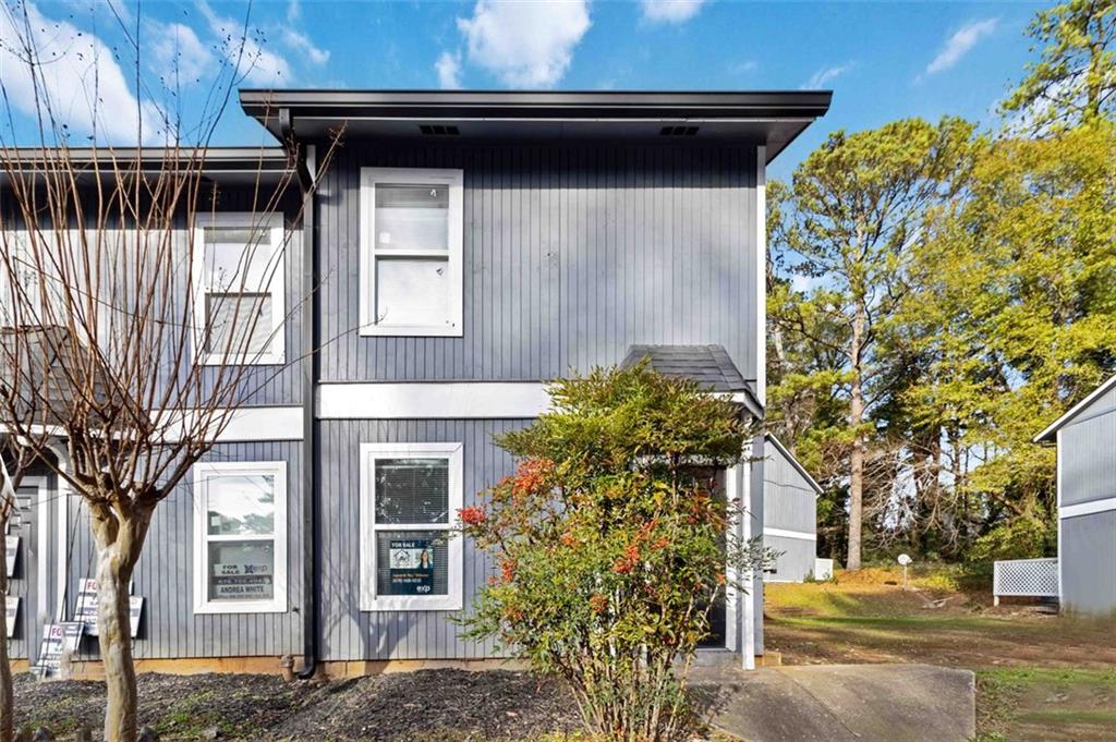 2340 Beaver Ruin Road, Unit 16 Norcross, GA 30071 - Photo 2 of 28 a front view of a house with garden