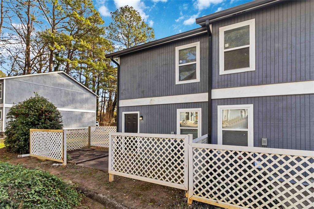 2340 Beaver Ruin Road, Unit 16 Norcross, GA 30071 - Photo 21 of 28 a side view of a house with a large window