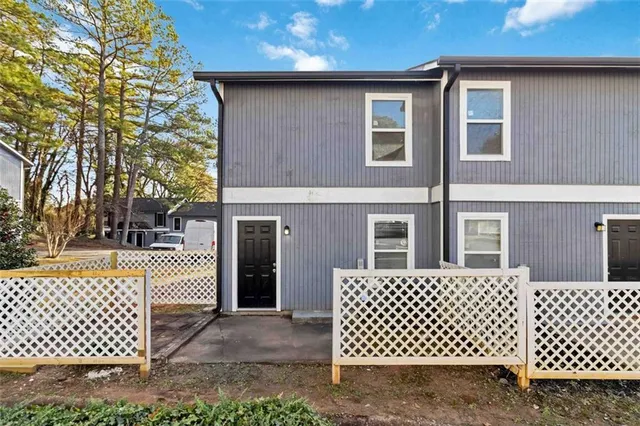 a front view of a house with parking