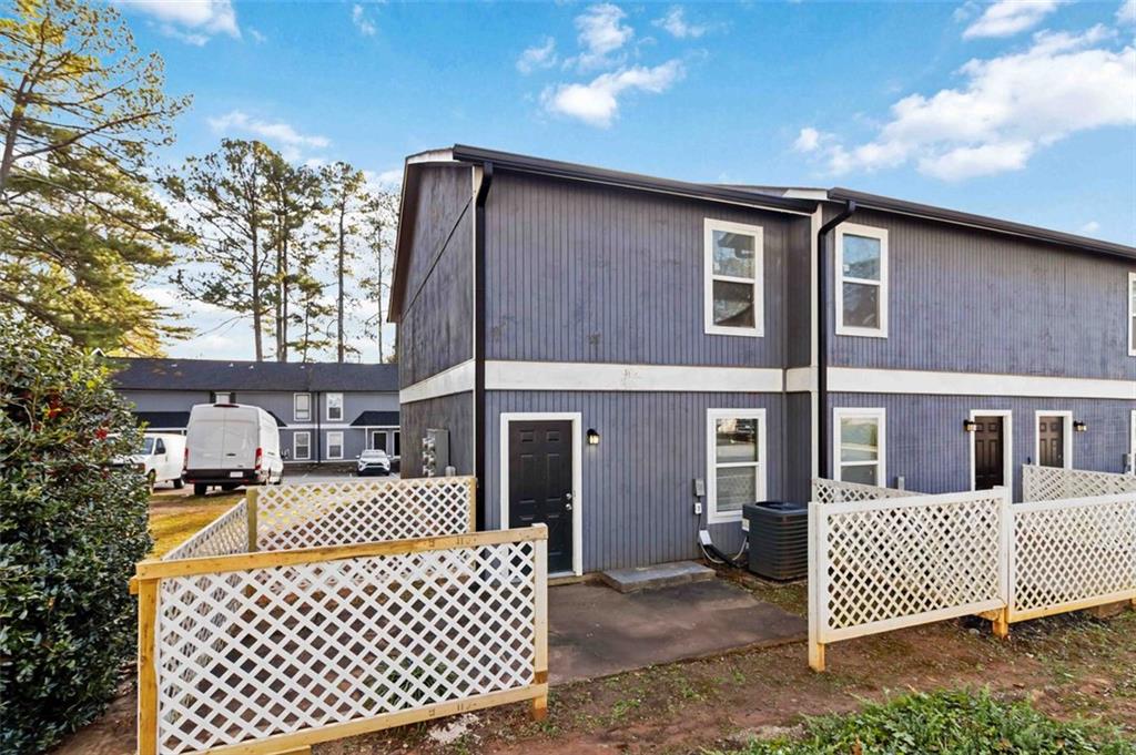 2340 Beaver Ruin Road, Unit 16 Norcross, GA 30071 - Photo 24 of 28 front view of a house with a bench